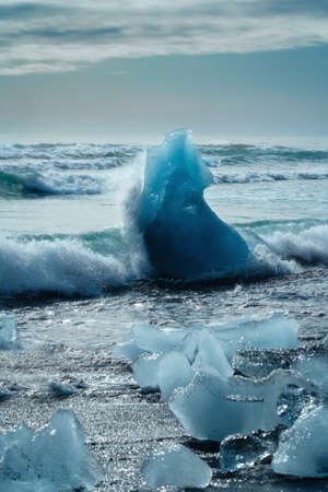 Diamond Beach (Jokulsarlon) landscape in East Iceland. Ice on black volcanic sand in the dayの写真素材