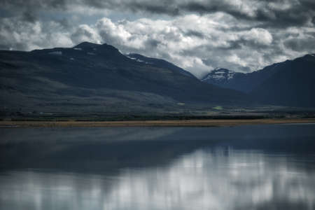 Mountains reflected in a lake. East Iceland landscapeの写真素材