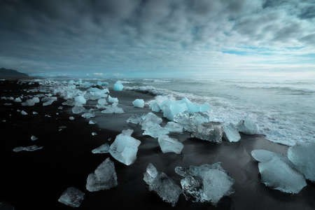 Diamond Beach (Jokulsarlon) landscape in East Iceland. Ice on black volcanic sand in the dayの写真素材