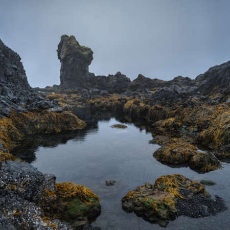 Western Iceland nature landscape. Djupalonssandur beach in Snaefellsnes (SnÃ¦fellsnes) peninsula. Stormy waves at rainy weatherの写真素材