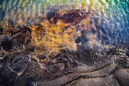 Abstract nature background. Colorful vibrant puddle in Iceland