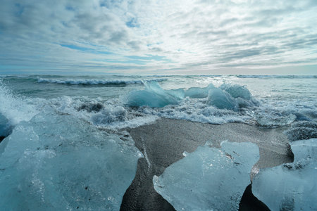 Diamond Beach (Jokulsarlon) landscape in East Iceland. Ice on black volcanic sand in the day