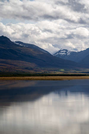 Mountains reflected in a lake. East Iceland landscapeの写真素材