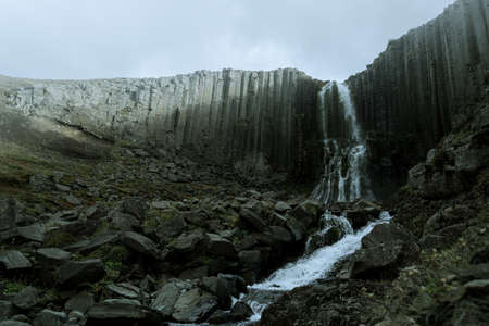 Studlafoss waterfall with basalt columns in East Icelandの写真素材