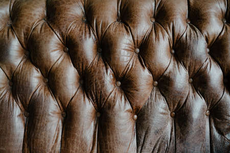 Vintage sofa brown leather abstract backgroundの写真素材