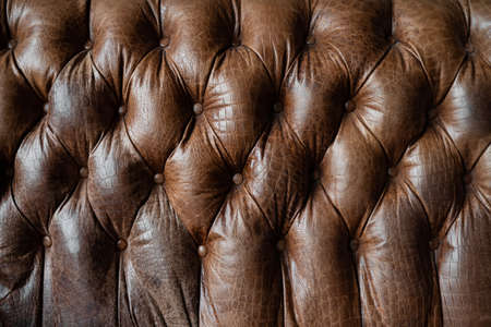 Vintage sofa brown leather abstract backgroundの写真素材