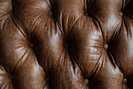 Vintage sofa brown leather abstract backgroundの写真素材