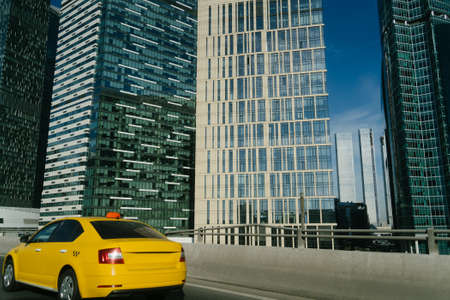 Taxi car are driving near downtown. Moscow City, business centerの写真素材