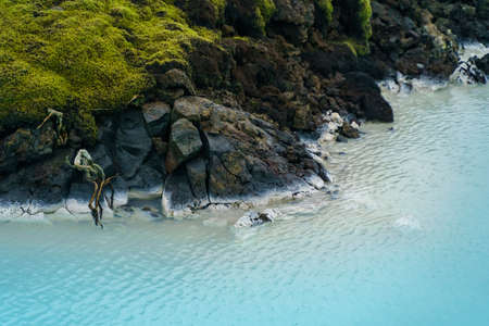 Turquoise water sulfur spring and lava field near Lagoon, Southern Peninsula. Icelandの写真素材