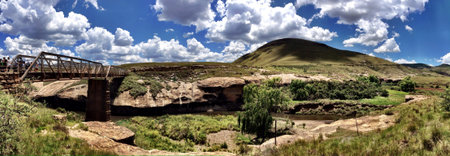 Panorama of a bridge over a river in some hills near Tiffindell 