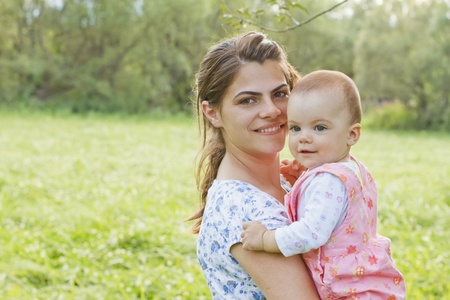 Baby girl with her motherの写真素材