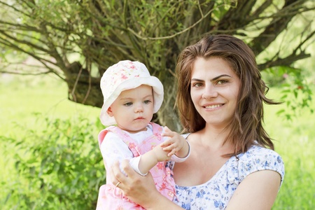 Baby girl with her motherの写真素材