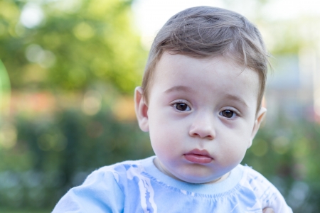 Portrait of a cute little baby boy with innocent eyes. の写真素材