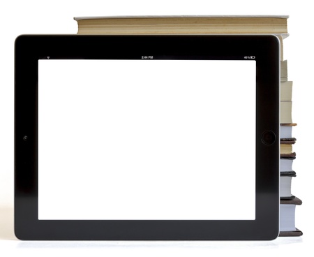 Books and tablet computer isolated on white, digital library conceptの写真素材