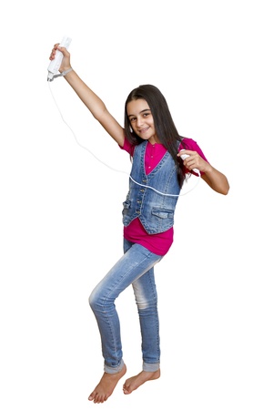 Galati, Romania- September 01, 2012: Young teenage girl holding a Nintendo Wii controller (gamepad). The Nintendo Wii game console is produced by Nintendo.のeditorial素材