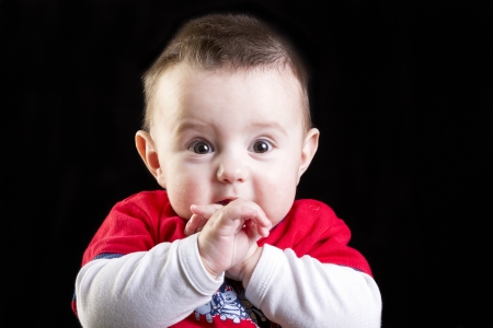Baby boy on black backgroundの写真素材
