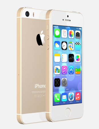 Gold iPhone 5s showing the home screen with iOS7  Some of the new features of the iPhone 5s include fingerprint recognition built into the home button, a new camera, and a 64-bit processor  Apple released the iPhone 5s on September 20, 2013 のeditorial素材