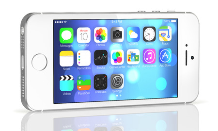  Silver iPhone 5s showing the home screen with iOS7. Some of the new features of the iPhone 5s include fingerprint recognition built into the home button, a new camera, and a 64-bit processor. Apple released the iPhone 5s on September 20, 2013.のeditorial素材