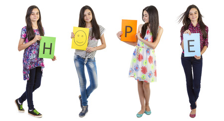Teenager girl showing the text hope on paperの写真素材