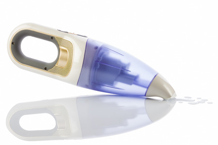 Small rechargeable vacuum cleaner - isolated on white background.の写真素材