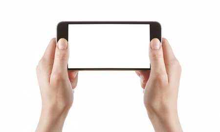 Young girl hands holding black smart phone isolated on white clipping path insideの写真素材