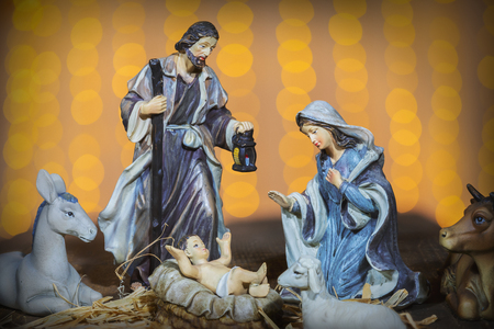 Christmas Manger scene with figurines including Jesus, Mary, Joseph and sheepの写真素材