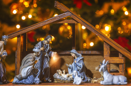 Christmas Manger scene with figurines including Jesus, Mary, Joseph and sheep. Focus on mother!の写真素材