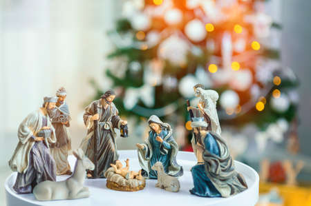 Christmas Manger scene with figurines including Jesus, Mary, Joseph, sheep and wise men. Focus on mother!の写真素材