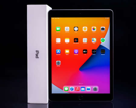 Galati, Romania, March 31, 2021: - Apple release new iPad 8th generation with the powerful A12Â BionicÂ chip, support for AppleÂ Pencil and the SmartÂ Keyboard. iPad 8th generation on black glass.のeditorial素材
