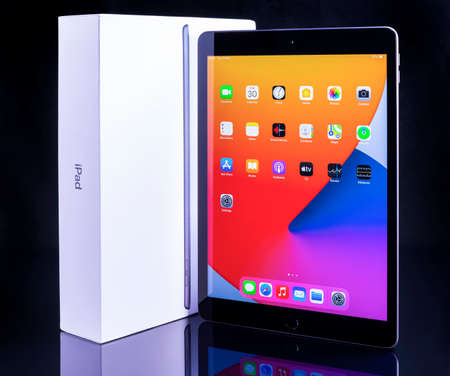 Galati, Romania, March 31, 2021: - Apple release new iPad 8th generation with the powerful A12 Bionic chip, support for Apple Pencil and the smart keyboard. iPad 8th generation on black glass.のeditorial素材