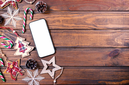 Smartphone mock up with rustic Christmas decorations for app presentation. View from aboveの写真素材
