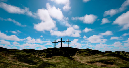 Crosses on a hillside with blue sky and clouds in the backgroundの写真素材