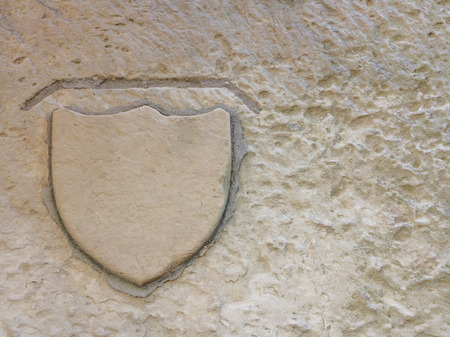 Blank crest on a limestone wallの写真素材