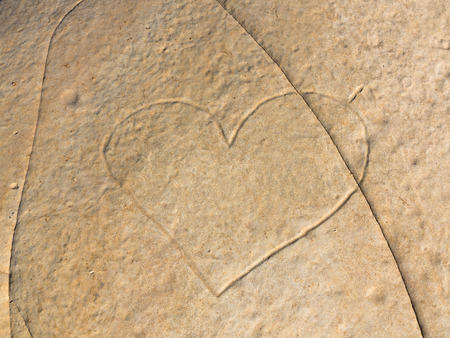 Heart sign, engraved in natural eroded stoneの写真素材