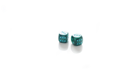 green dice on a white backgroundの写真素材