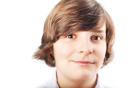 Portrait of a white boy with brown eyes and brown hair on a white backgroundの写真素材