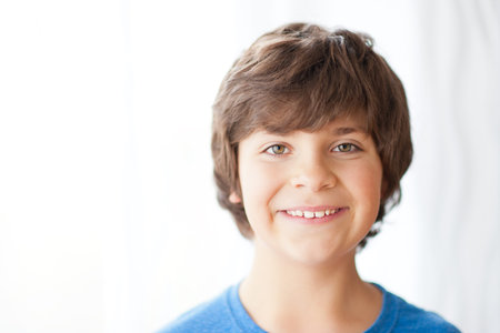 Portrait of a European school-age boy, smiling, looking into the camera