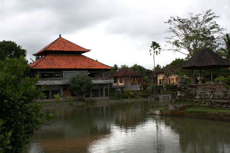Old Balinese temple on the shore of a calm lakeの写真素材