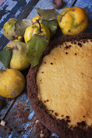 Sweet lemon cake surrounded ripe yellow quince.の写真素材