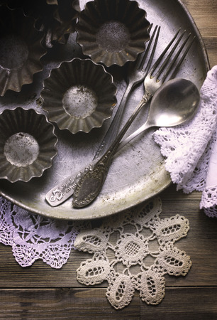 The old kitchen utensils and vintage lace napkinsの写真素材