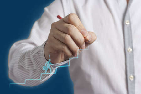 Male hand drawing a chartの写真素材