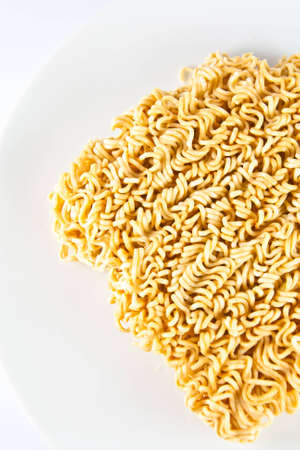 A block of Instant noodles on white background の写真素材
