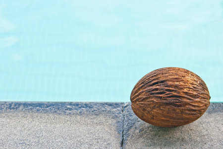 brown ball above swimming pool 