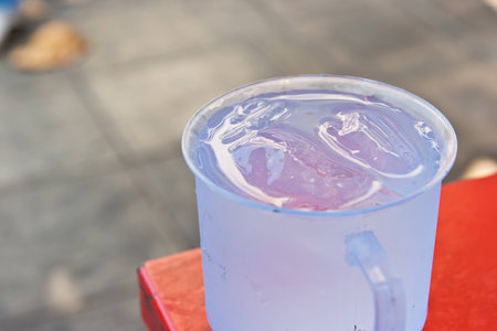 water in plastic glassの写真素材