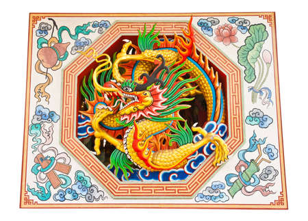 Oriental design of an ancient Chinese dragon on a temple wall in Thailandの写真素材