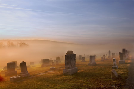 Fog rolling into Manchester Cemetery makes it a more spooky place than usualの写真素材