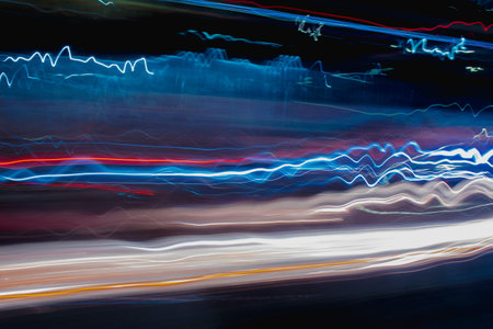Speedy lines in waves at night, fast colorful lines.