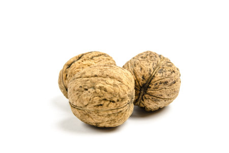  dried walnuts on white background 