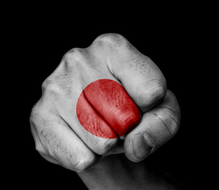 Front view of punching fist, banner of Japan の写真素材