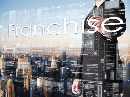 Businessman writing on virtual screen Franchiseの写真素材